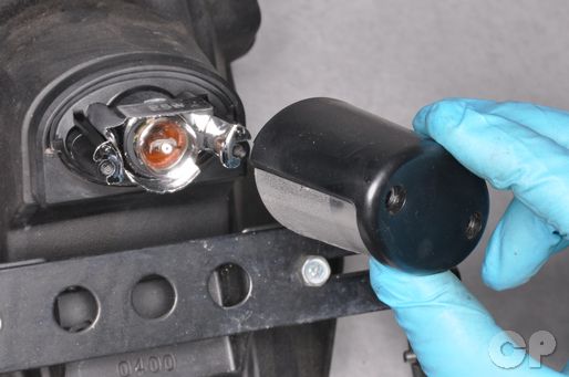 remove the cover from the tag light on the Kawasaki Ninja 250.