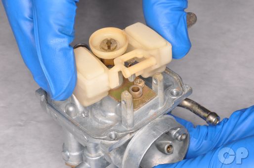 Remove the float bowl from the DR-Z125 carburetor in the fuel system chapter