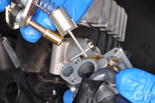 Remove the choke and throttle valve from the JR50 carburetor.