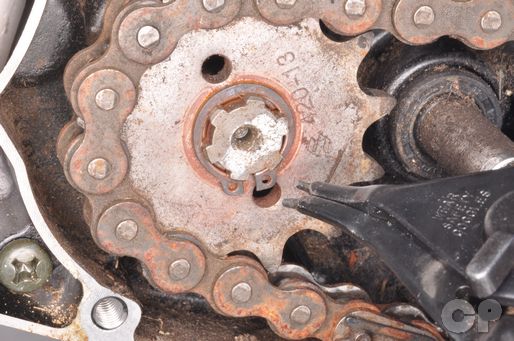 Remove the front sprocket snap ring with snap ring pliers.