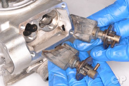 Remove the YZ-125 power valves and clean them.