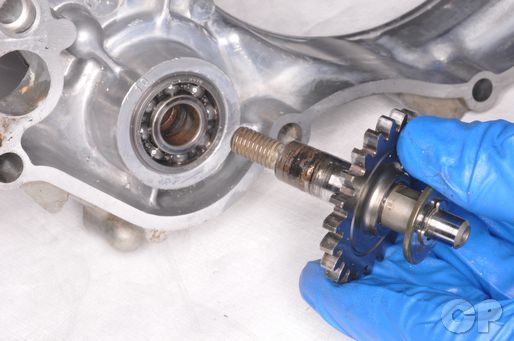 Remove the YZ-125 water pump shaft from the inside of the right crankcase cover.