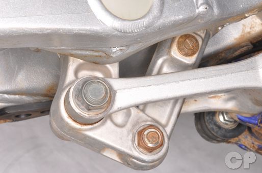 Disconnect the rear suspension linkage before removing the swingarm on the YZ125.