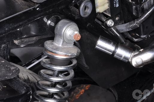Honda CB250 Nighthawk rear shock absorber upper mounting bolt removal torque installation.