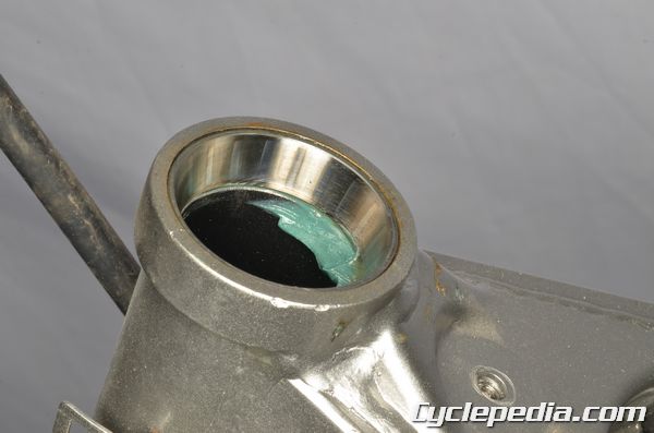 Kawasaki KLX140 steering bearings races inspection installation replacement grease nut adjustment
