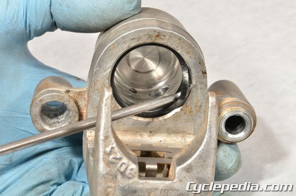 Suzuki RM 80 RM85 brake caliper dust and fluid seal replacement rebuild